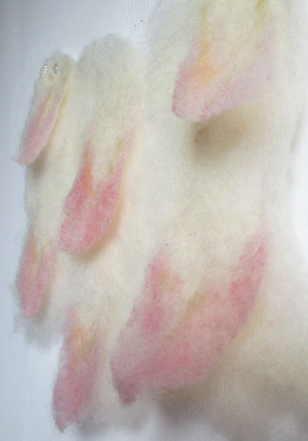 6 - Sample showing flaps of felt with pink tips that can be lifted from the main fabric