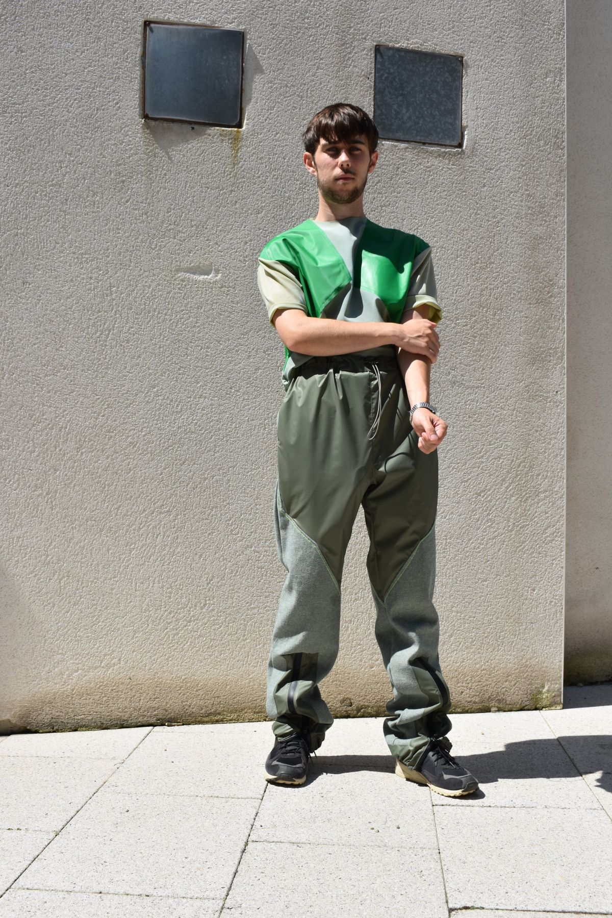 5 coated nylon and cotton denim trousers with zipper detail.