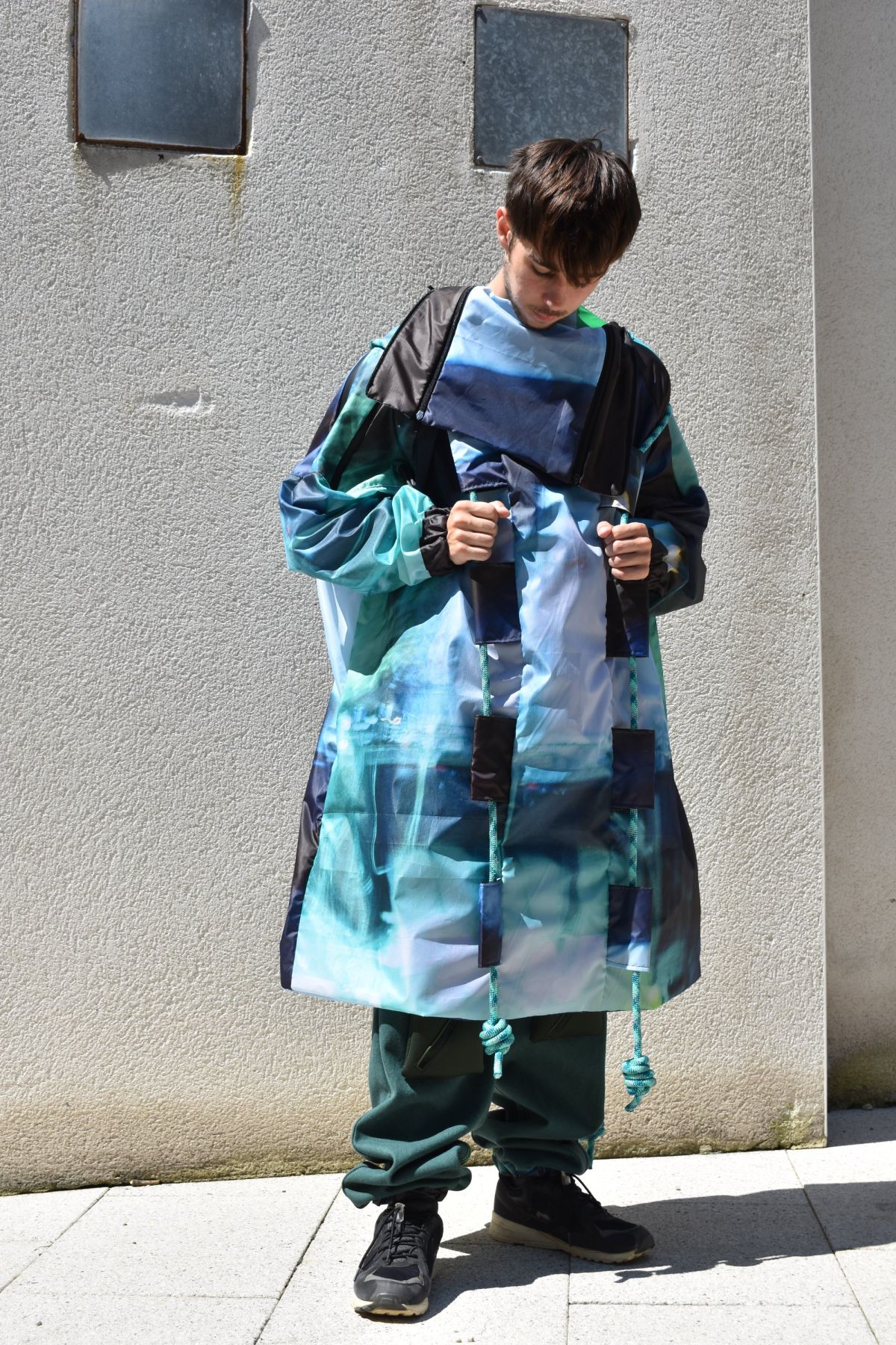 3 digitally printed ripstop coat with paracord detail.
