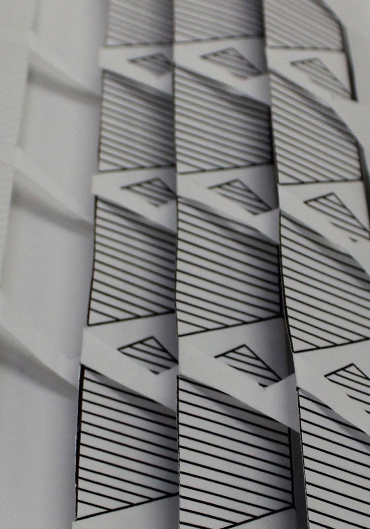 2- Pleated paper cut outs used in design development process.