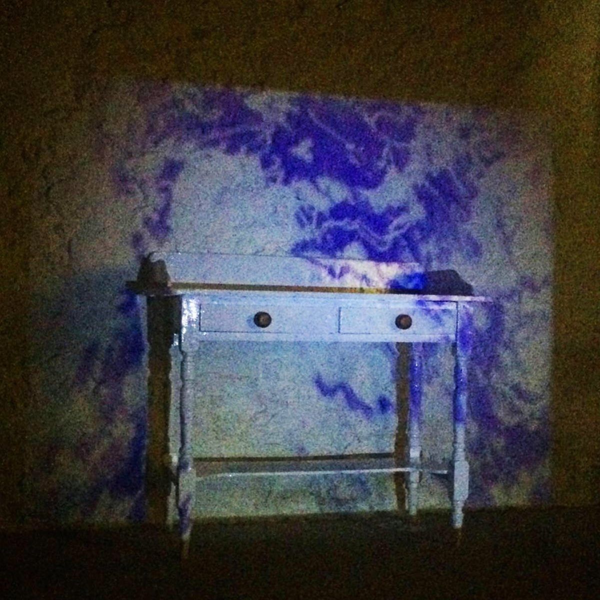 1.Interactive wallpaper design projected over up-cycled table