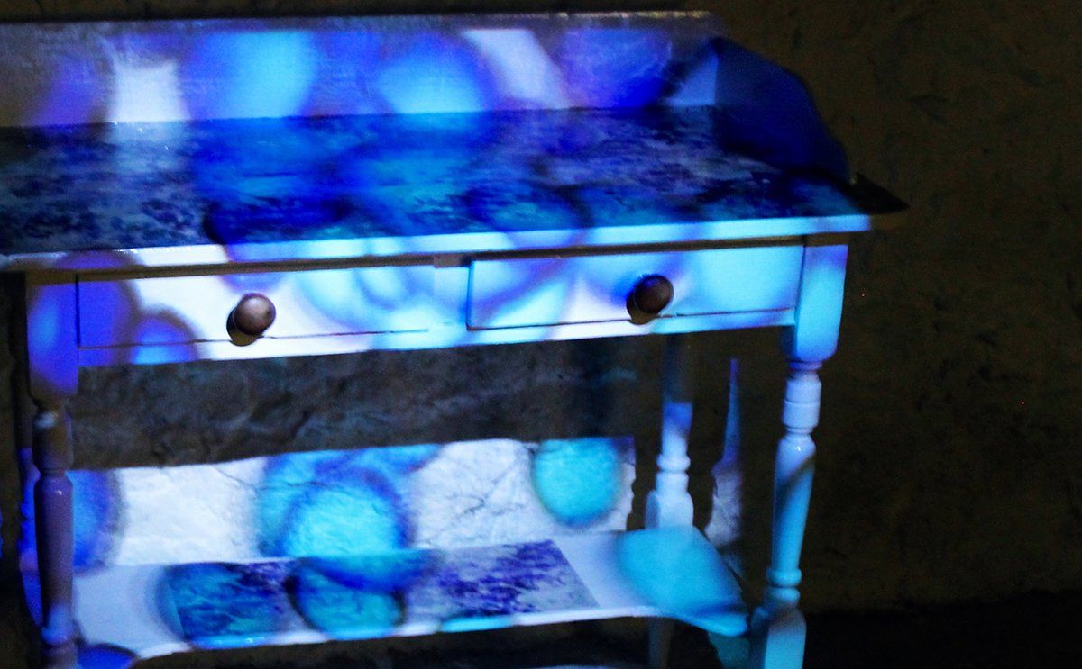 2. Interactive wallpaper design projected over up-cycled table