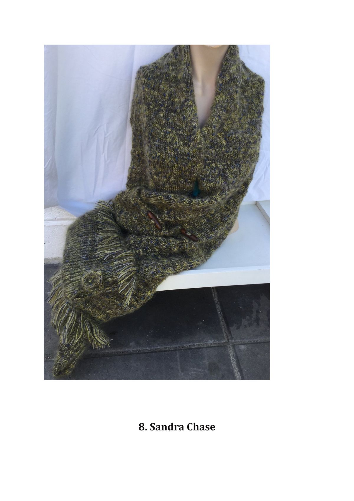 Image 8. Knit using tuck stitch to make a scarf with pockets to keep personal items safe and person warm.