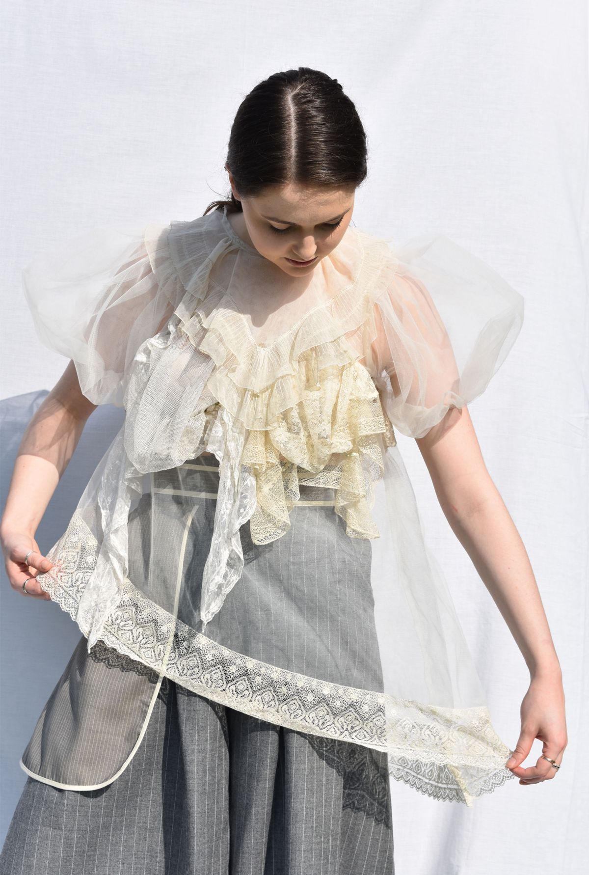 -Every Grace and Blessing You Need - Outfit 1; Underlayer, suiting wool trousers with large outer pocket detail, and vintage lace pieces with bridal tulle.